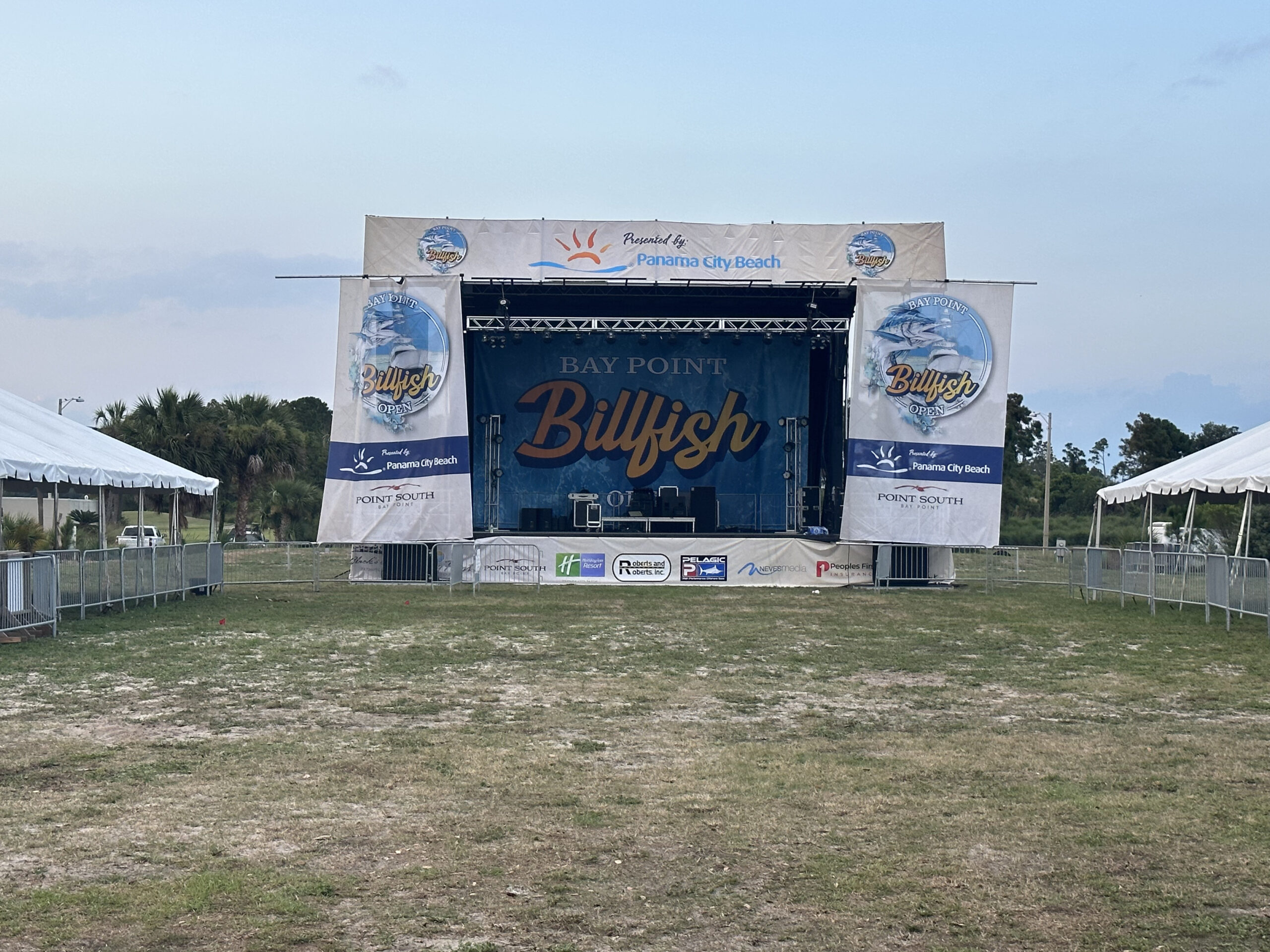 Event stage at Bay Point for the Billfish Open, showcasing Panama City Beach and local sponsors. Neves Media supports local events in Panama City, FL.