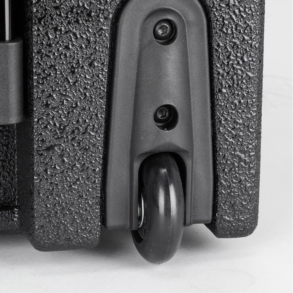 Close-up of a textured black surface and wheel, showcasing durable design. For top-notch digital marketing, contact Neves Media in Panama City, FL.